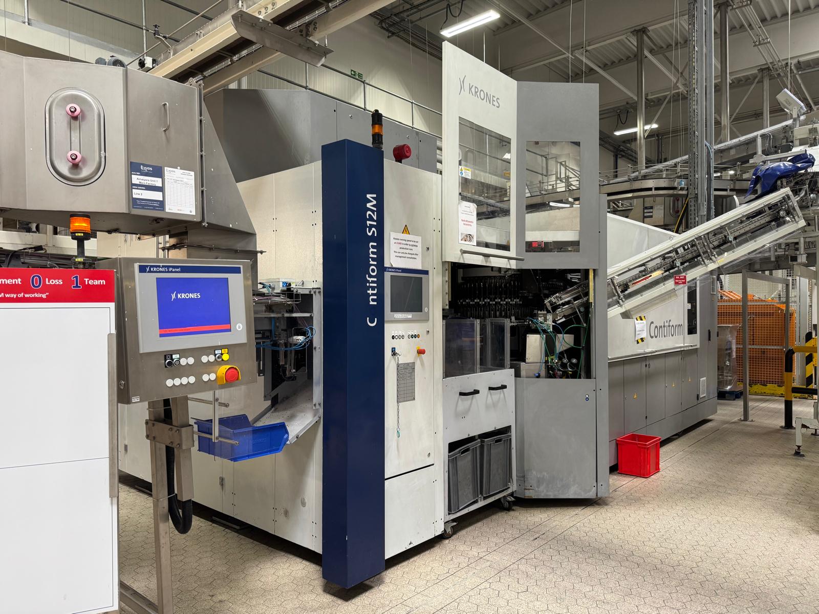 Krones Type S12M Bottle Blow Moulder for pre-formed stock. Incudes Pallet Tipper, Stainless Steel Ho - photo 1