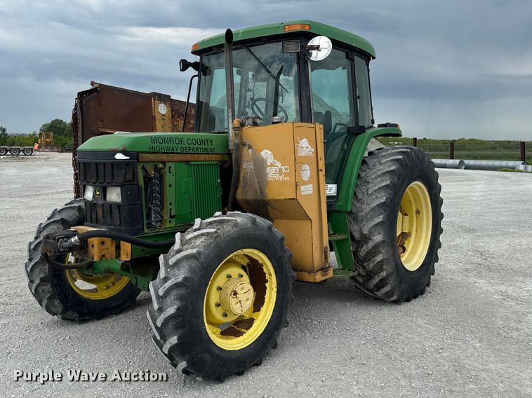 2001 John Deere 6405 MFWD Tractor - photo 1