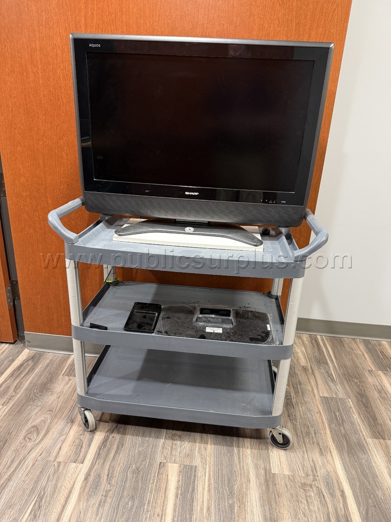 TV mounted on gray cart — photo 1