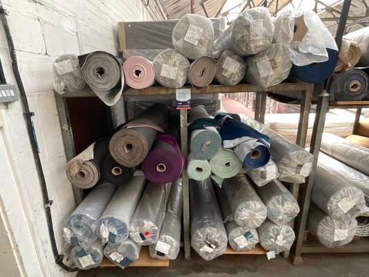Approx 32 Various Rolls Fabric in Metal Stock Rack - photo 1