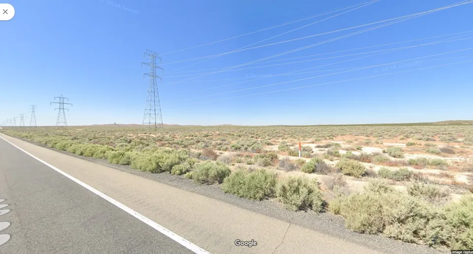 California City, 2.45 acres of land, rides the speed train to Los Angeles. Owner financing $1.00