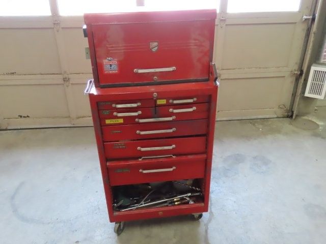 Red Toolbox On Wheels With Miscellaneous Tools (P)