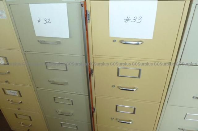 9 Vertical Metal Filing Cabinets