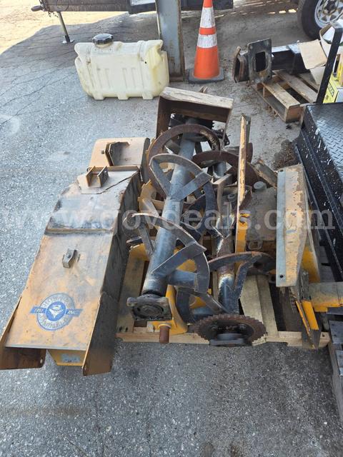 Pallet of Trackless snowblower parts + a sander off a MaClean unit