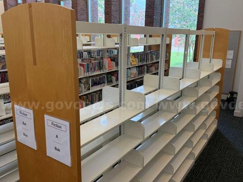 Bookcase with metal shelving and wood end caps