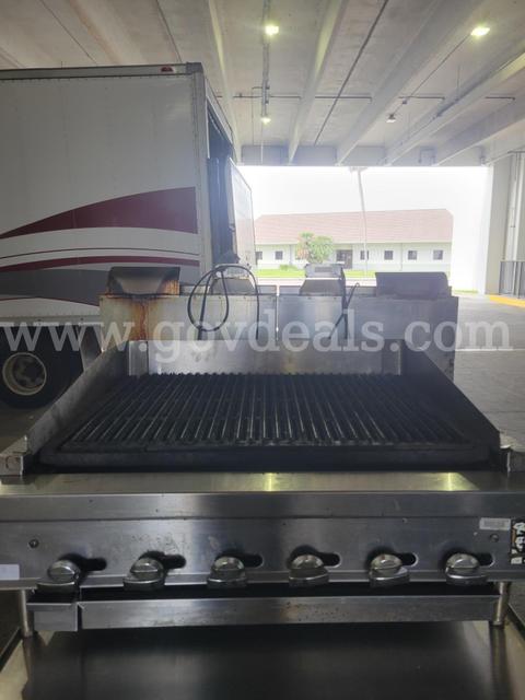Montague charbroiler grill w/ Traulsen reach in cooler base