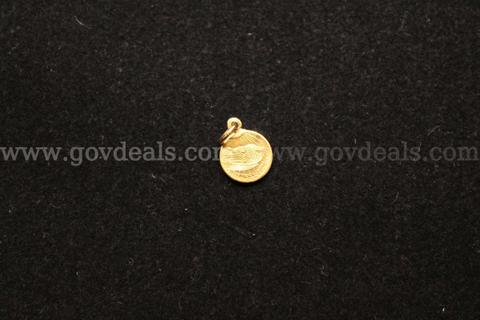 1- Small Gold Colored Coin In A Gold Colored Bezel
