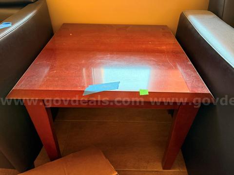 Two wooden lobby tables