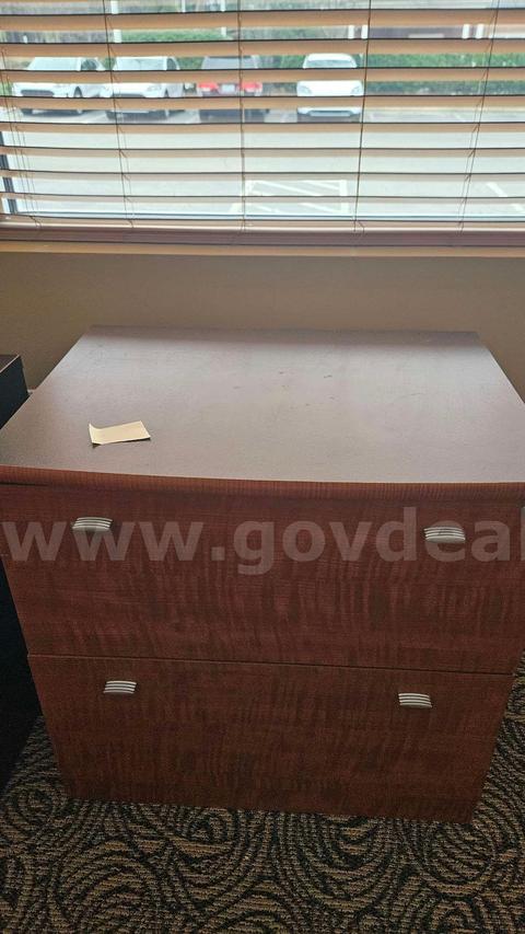 Wooden cabinet with polished handles