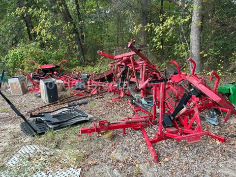 Lot of 9 mower decks -- blades and other parts missing -- with various frames