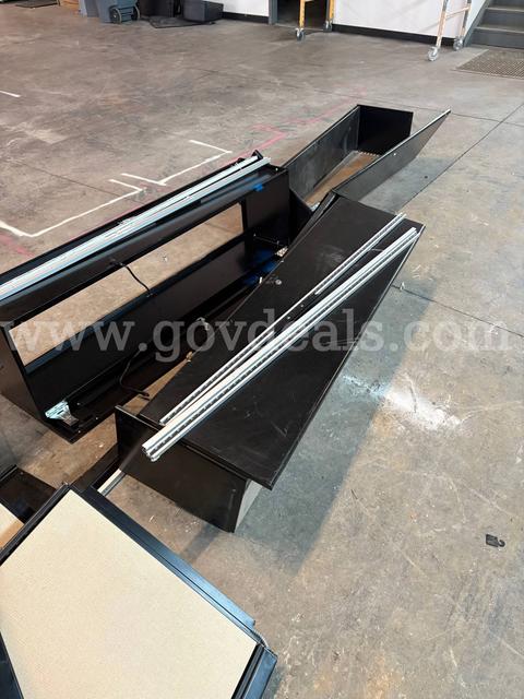 Black overhead cabinets with pinboards