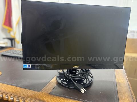Three computer monitors