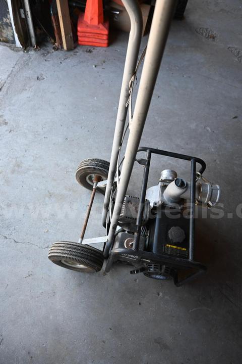 Power fist 6.5 HP water pump welded to 2 wheeled dolly