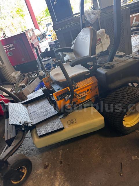 Cub Cadet Commercial Tank Zero Turn Mower equipped with a "ride-on sprayer" attachment,