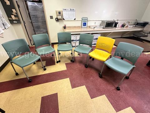 Selling 6 (six) hard plastic rolling chairs.