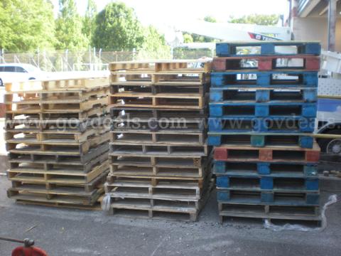 3 stacks of used wooden pallets