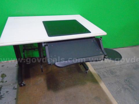 Rolling computer tables with glass top insert, pullout keyboard and mouse tray. Qty 14
