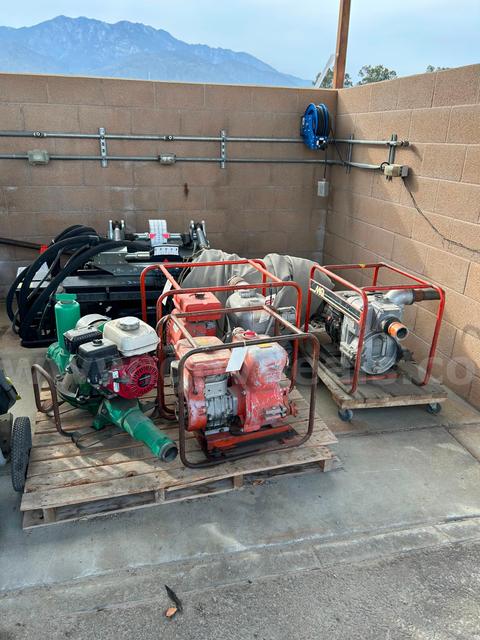 Lot of 4 used trash pumps and 1 used portable generator