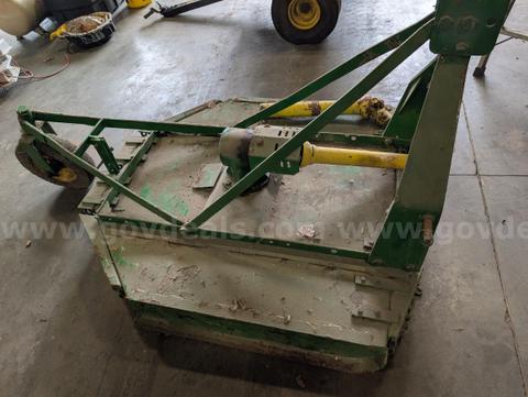 4-foot 3-point hitch rotary cutter. PTO-driven. Includes PTO shaft and tail wheel. Used condition with surface rust, pai