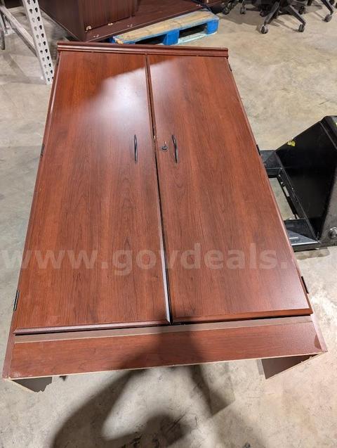 1 usded large brown wood cabinet