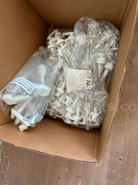 Lot of expired hand sanitizer with various bottles and pumps