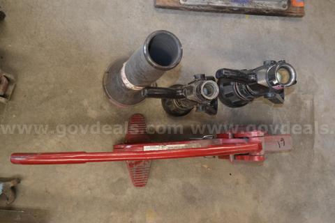 Lot to include lever style hose clamp, 1.5" fog nozzle, 1" fog nozzle, Nozzle foam tube