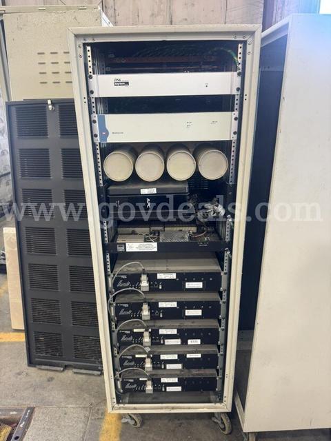Lot of 8 Motorola cabinets and equipment racks with misc hardware and components installed