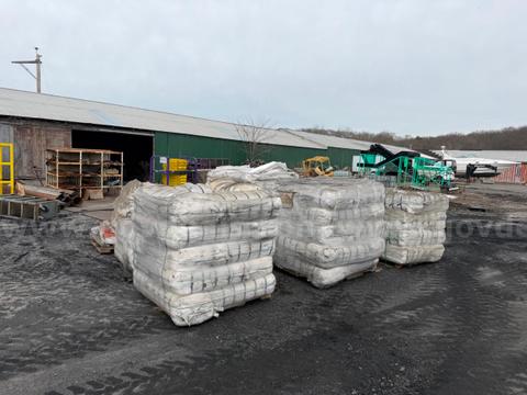 New unused sand bags on pallets