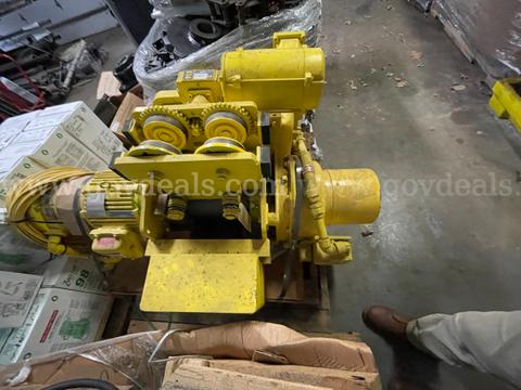 Industrial electric hoist / overhead trolley assembly. Heavy-duty material handling component designed for use with an o