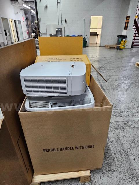 7 Projectors (used & new) for auction. Sold As-Is.