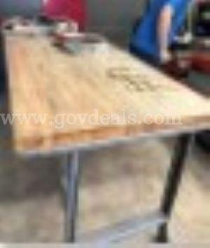 Industrial workbench Heavy-duty featuring a thick, edge-grain wooden butcher blo
