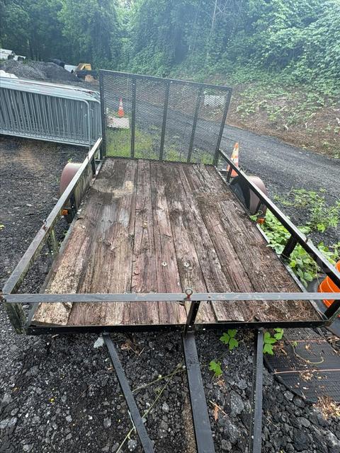 Used Landscape Utility Trailer with a Wooden Deck