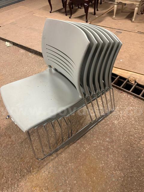 (7) Stackable Gray Chairs
