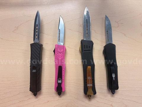 lot of four OTF knives