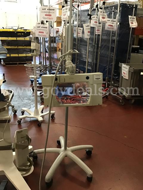 Lot of 14 - 9 monitoring machines Stands and 2 exam mirrors, 1 magnifying lights