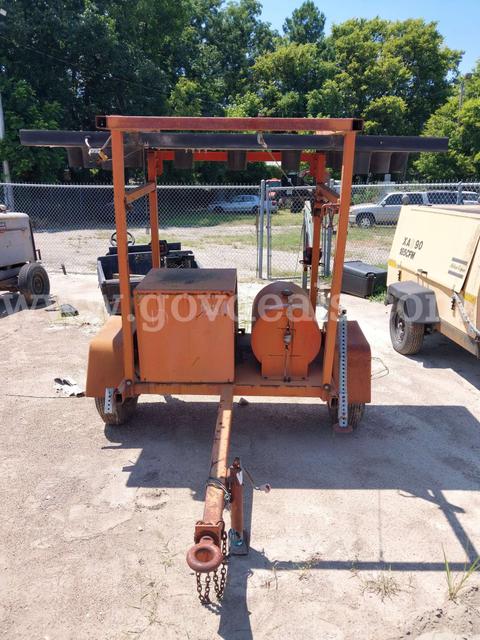 Trailer-Mounted Portable Light Tower with Integrated Generator Housing