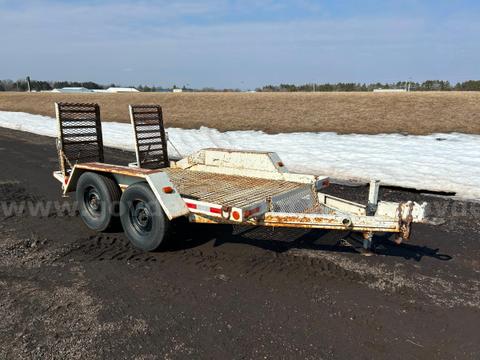 White trailer with built in ramps