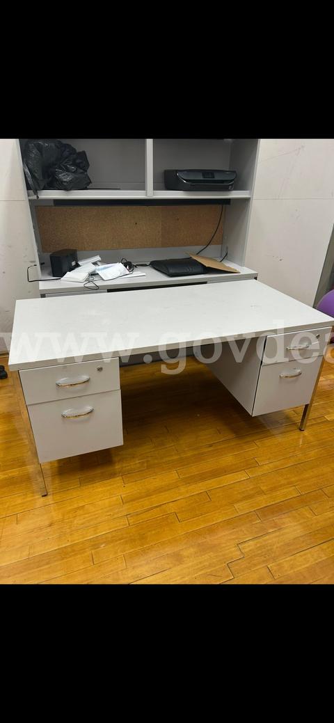 Lot of 2 used desks - 1 desks has a cabinet.