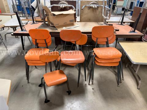 9 orange plastic chairs