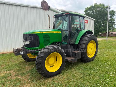 John Deere 6715 with limb saw
