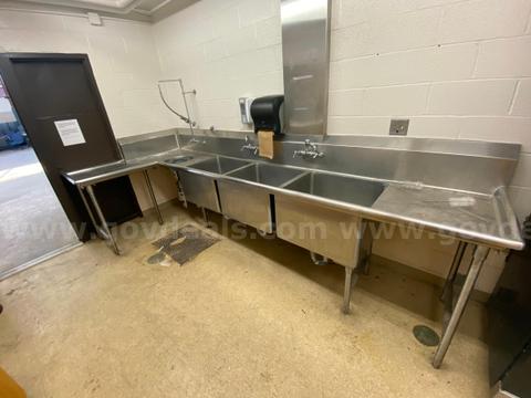large L-shaped stainless sink with grinder disposal