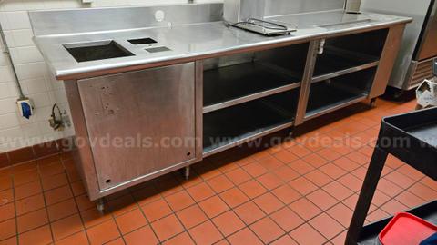 Stainless Steel kitchen worktable with storage, drain, place to insert sink.