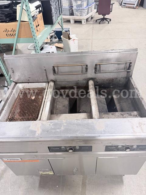 High-Efficiency, Open-Pot Gas Floor Fryer System featuring a built-in filtration unit.