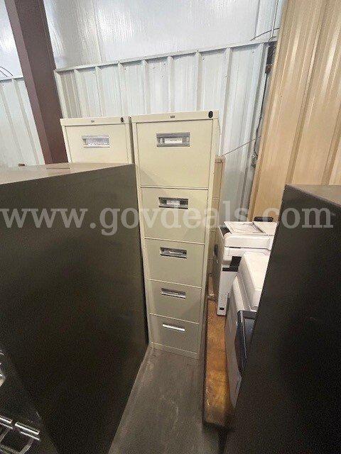 4 metal filing cabinets