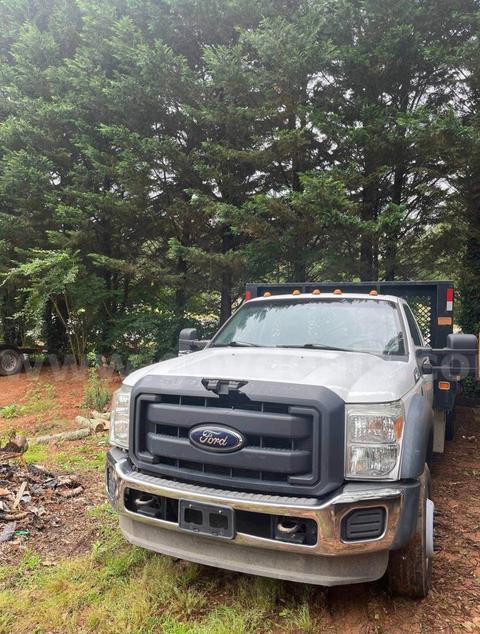 2012 F-550 diesel truck. 6.7 L power stroke diesel engine. 16 ft long flatbed. Two utility boxes.