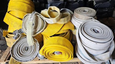 Large assortment of used fire hose for sale.