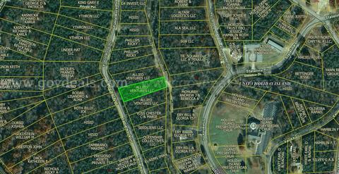 Finance your Ozark getaway on this 0.51 acre wooded lot on Holiday Island Arkansas