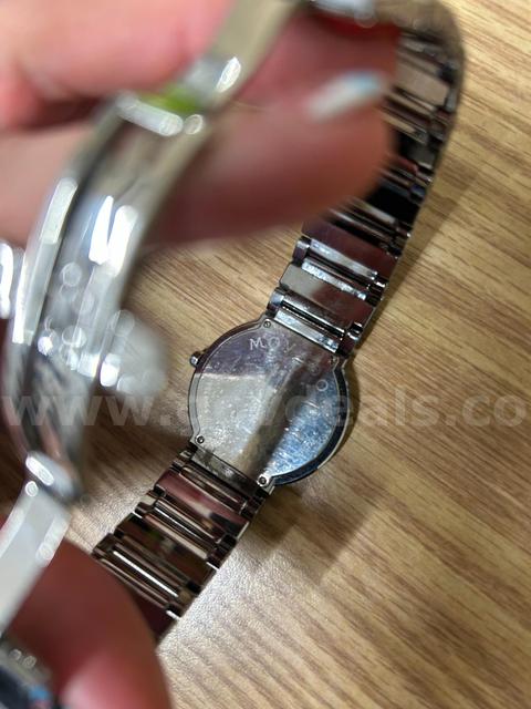 Movado silver colored watch