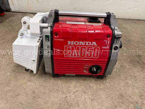 Portable gas generator with attached light