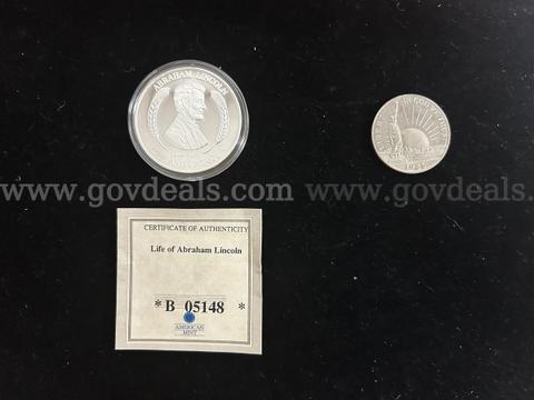 TWO COMMEMORATIVE COINS (1) ABRAHAM LINCOLN, (1) STATUE OF LIBERTY